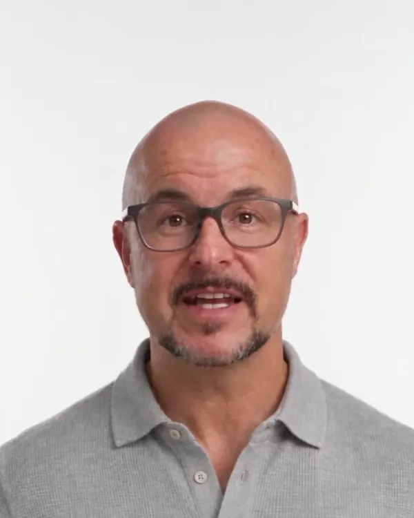 The presenter in a clean white studio